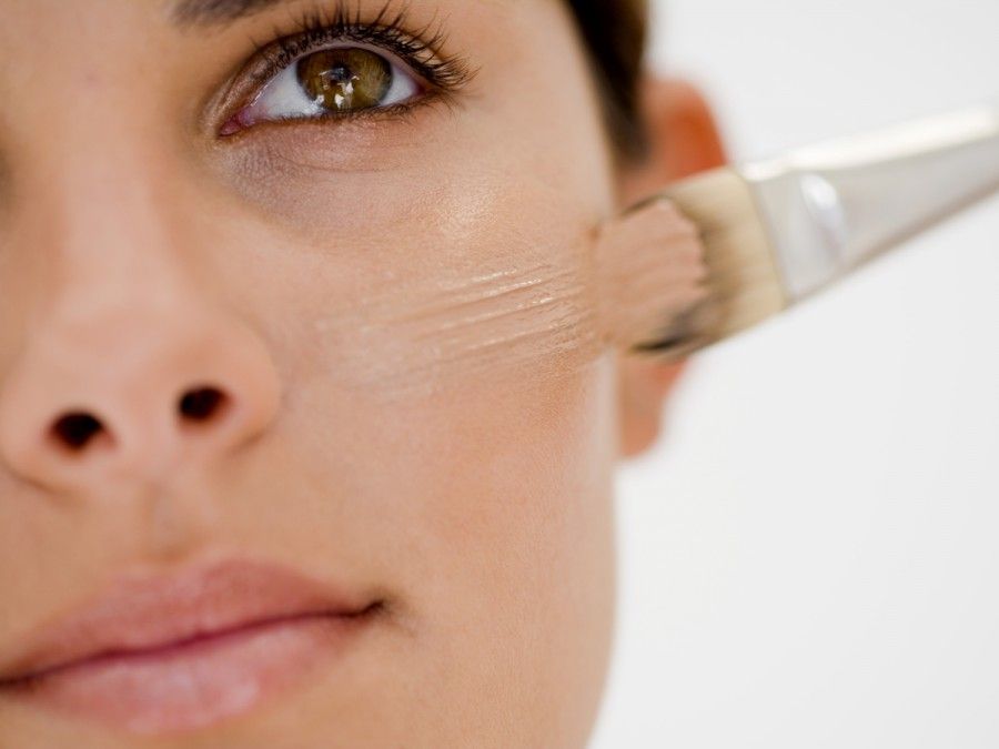 Woman applying base