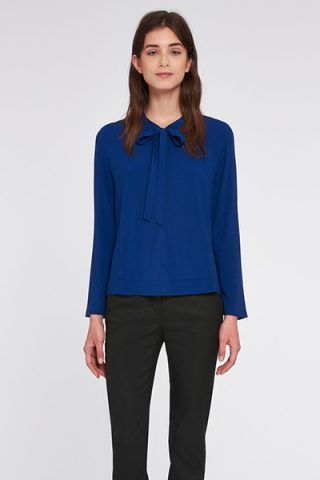 Blusa con fiocco di Pennyblack (38 €)