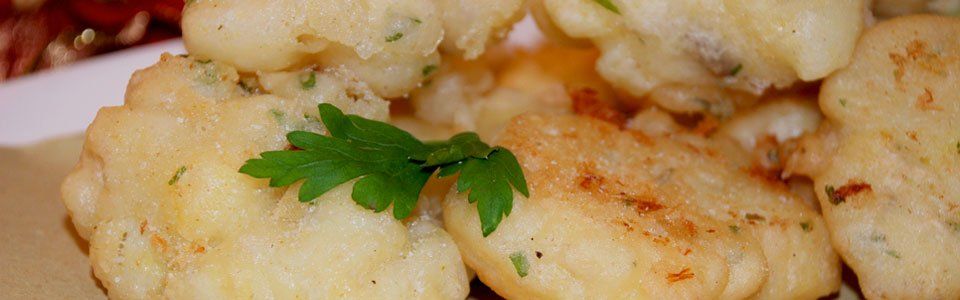 Le frittelle di Natale con mele e baccalà: una ricetta golosa