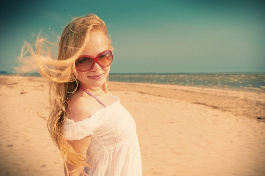 Romantic girl dreaming at sea coast