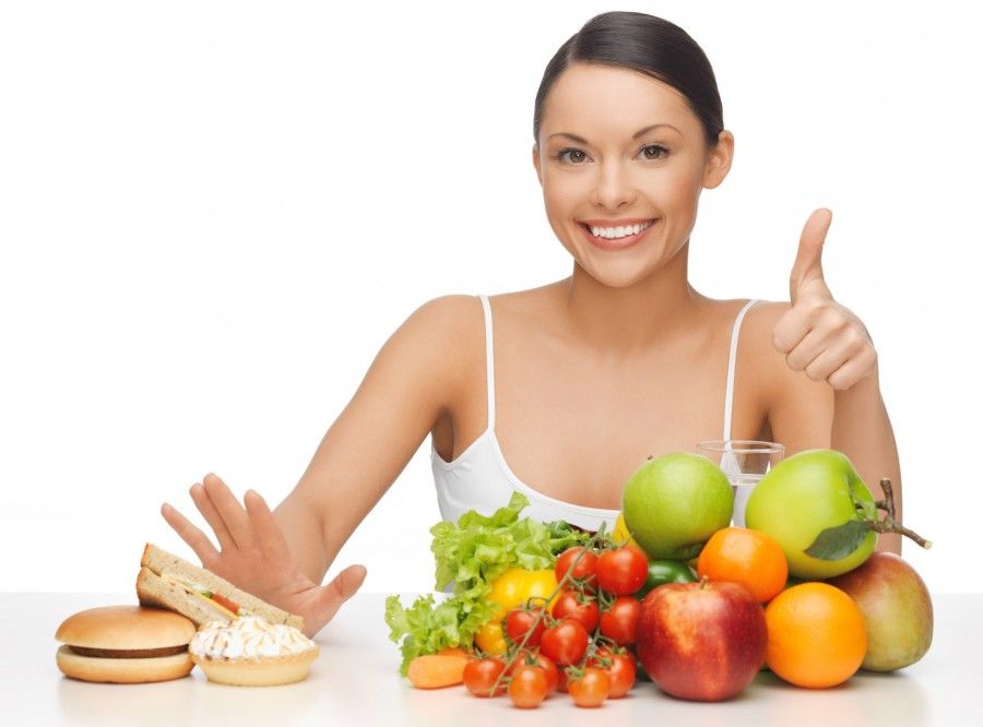 picture of woman with fruits showing thumbs up