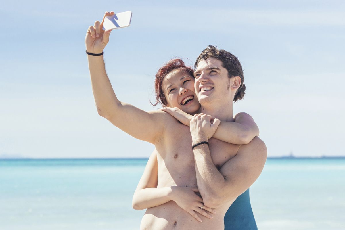 Young Couple Taking Selfie at Beach