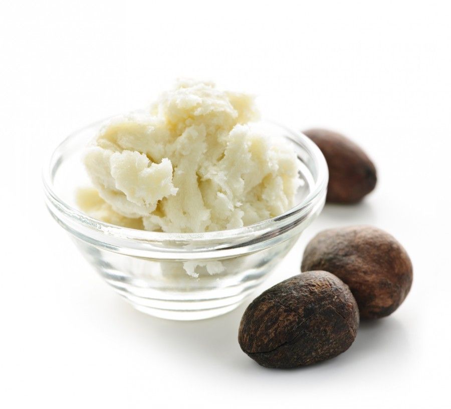 Shea butter and nuts in bowl