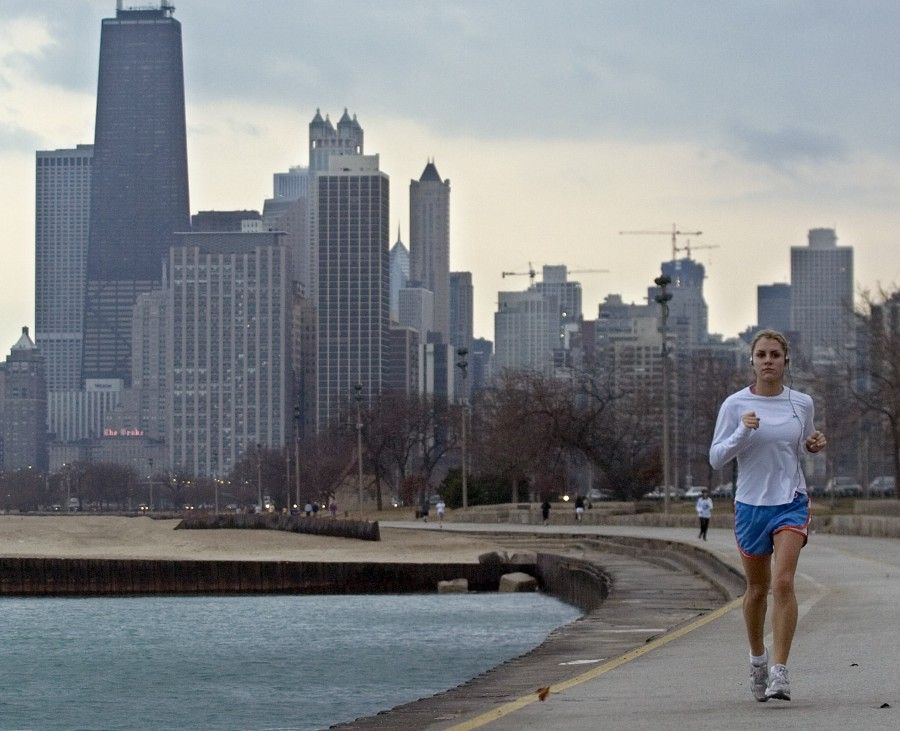 1-7-2008----A record-breaking high temperature brought out joggers in spring attire Monday afternoon. This woman is jogging along the lakefront near Fullerton. Sun-Times photo by Tom Cruze