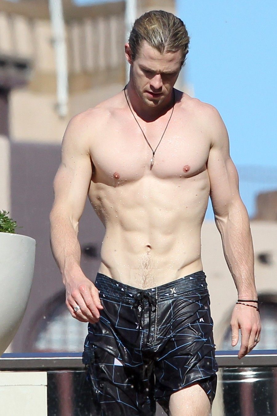 Chris Hemsworth shows off his ripped body as he chills by his hotel pool. Pictured: Chris Hemsworth Ref: SPL407263  180612   Picture by: Blue Wasp/Grey Wasp/Splash News Splash News and Pictures Los Angeles:310-821-2666 New York:212-619-2666 London:870-934-2666 photodesk@splashnews.com 