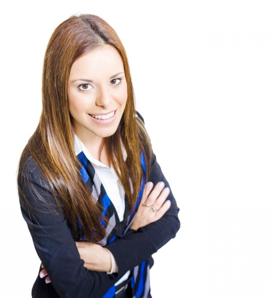 Isolated High Angle On A Beautiful And Successful Business Woman With Smile Standing With Arms Folded In A Customer Service And Relations Career Concept