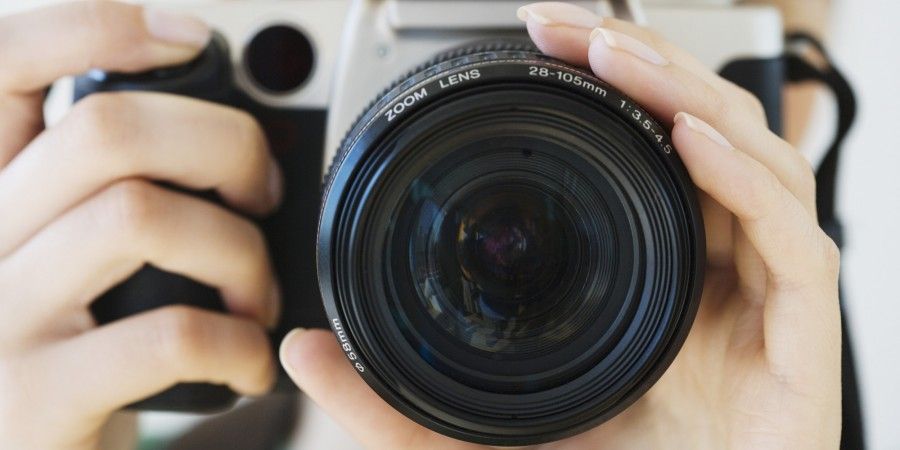 Close up of woman pointing camera