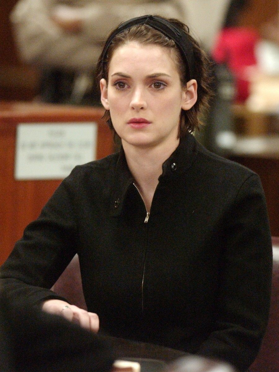 Actress Winona Ryder reacts in court during her sentencing hearing for shoplifting at the Beverly Hills Municipal Court on December 6, 2002 in Beverly Hills, California. The 31 year-old actress was sentenced to three years probation, 480 hours of community service for shoplifting from Saks Fifth Avenue, ordere