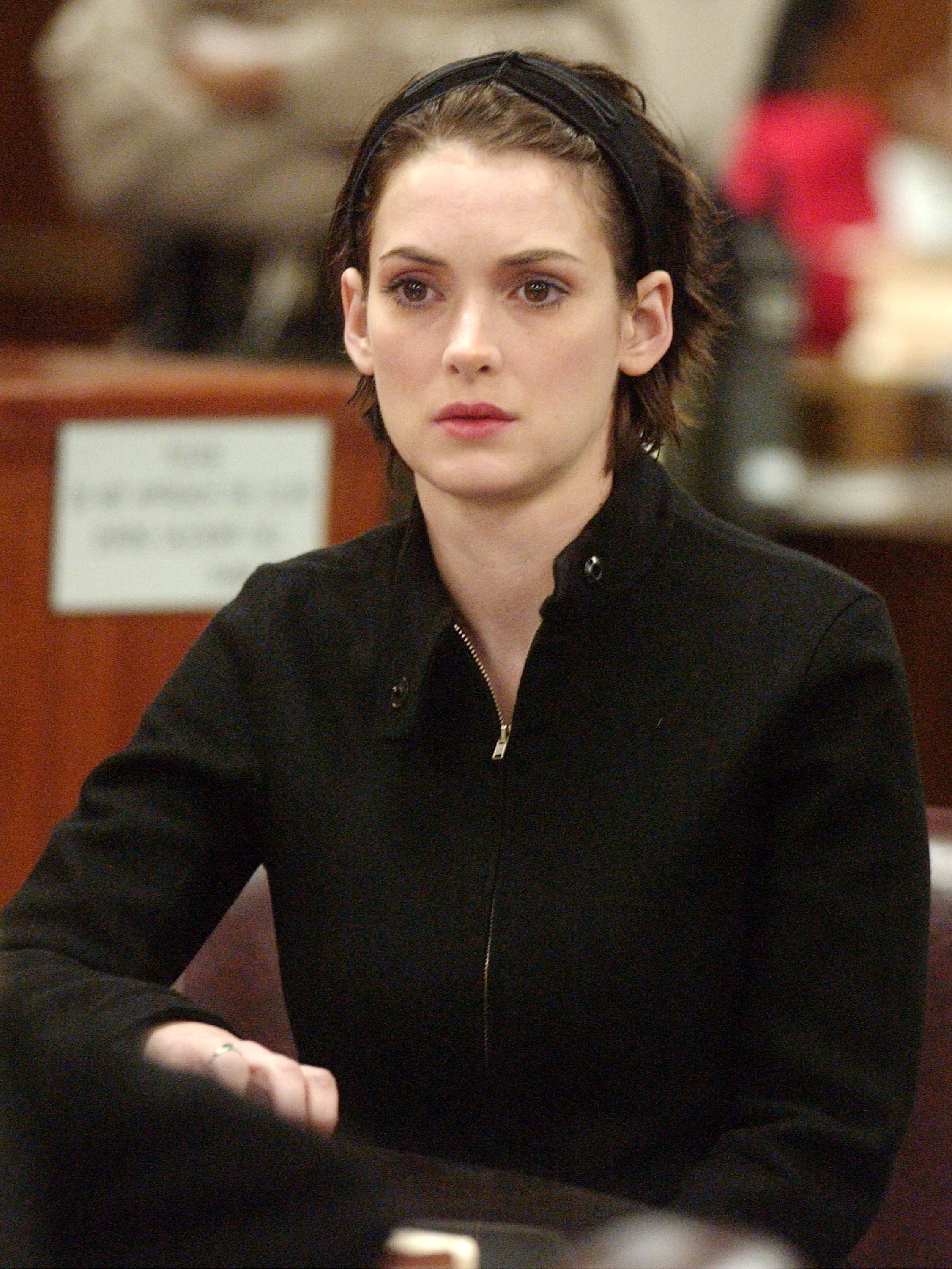 BEVERLY HILLS, CA - DECEMBER 6:  Actress Winona Ryder reacts in court during her sentencing hearing for shoplifting at the Beverly Hills Municipal Court on December 6, 2002 in Beverly Hills, California. The 31 year-old actress was sentenced to three years probation, 480 hours of community service for shoplifting from Saks Fifth Avenue, ordered to pay more than $11,300 in fines and ordered to take drug and psychological counseling. (Photo by Steve Grayson-Pool/Getty Images)