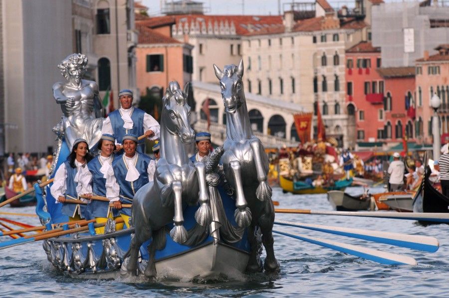 People wearing traditional costumes cruise along the Grand Canal in Venice on September 2, 2012 during a historical regatta.    AFP PHOTO / MARCO SABADIN