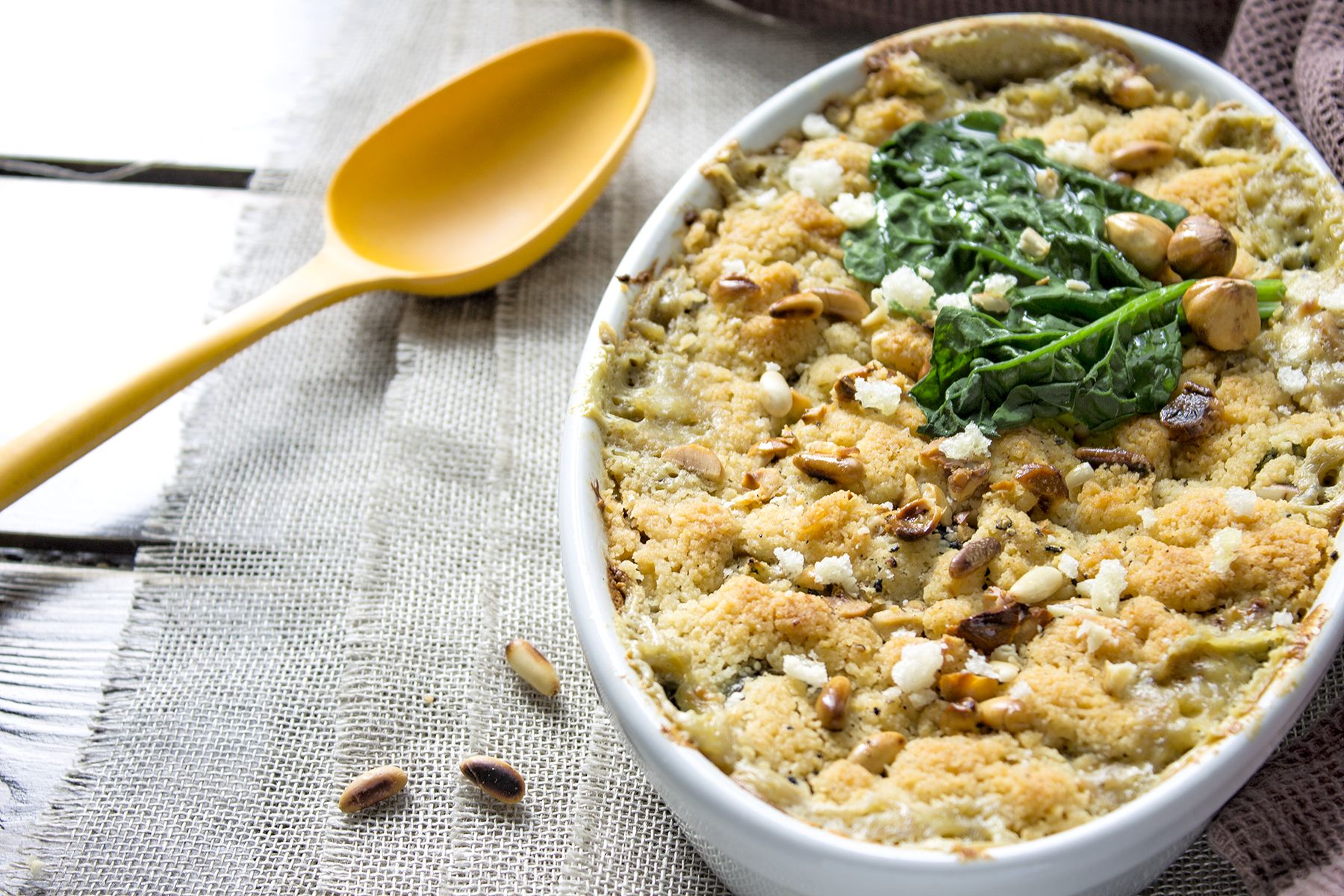 Crumble di spinaci con pinoli e nocciole