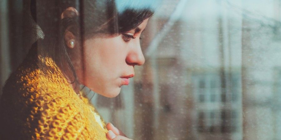 Woman standing at the window