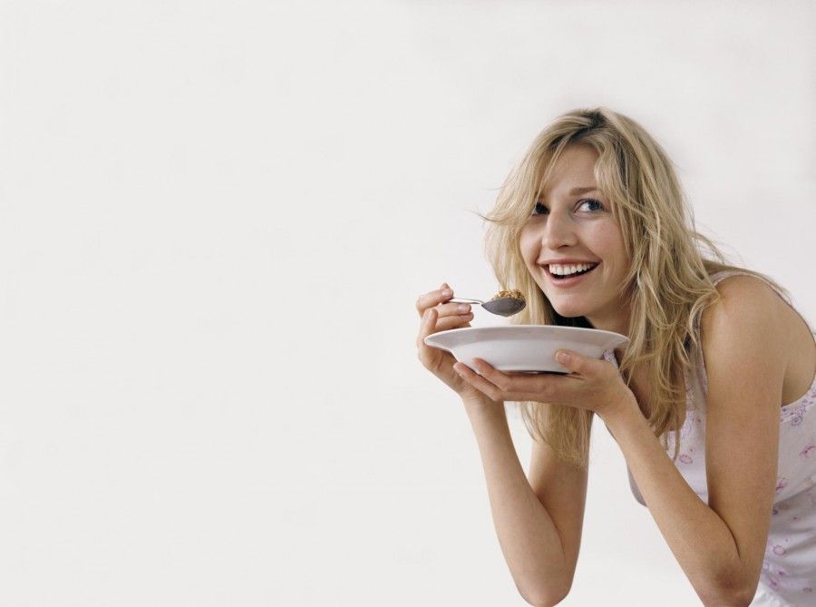 Woman Eating Cereals From a Plate