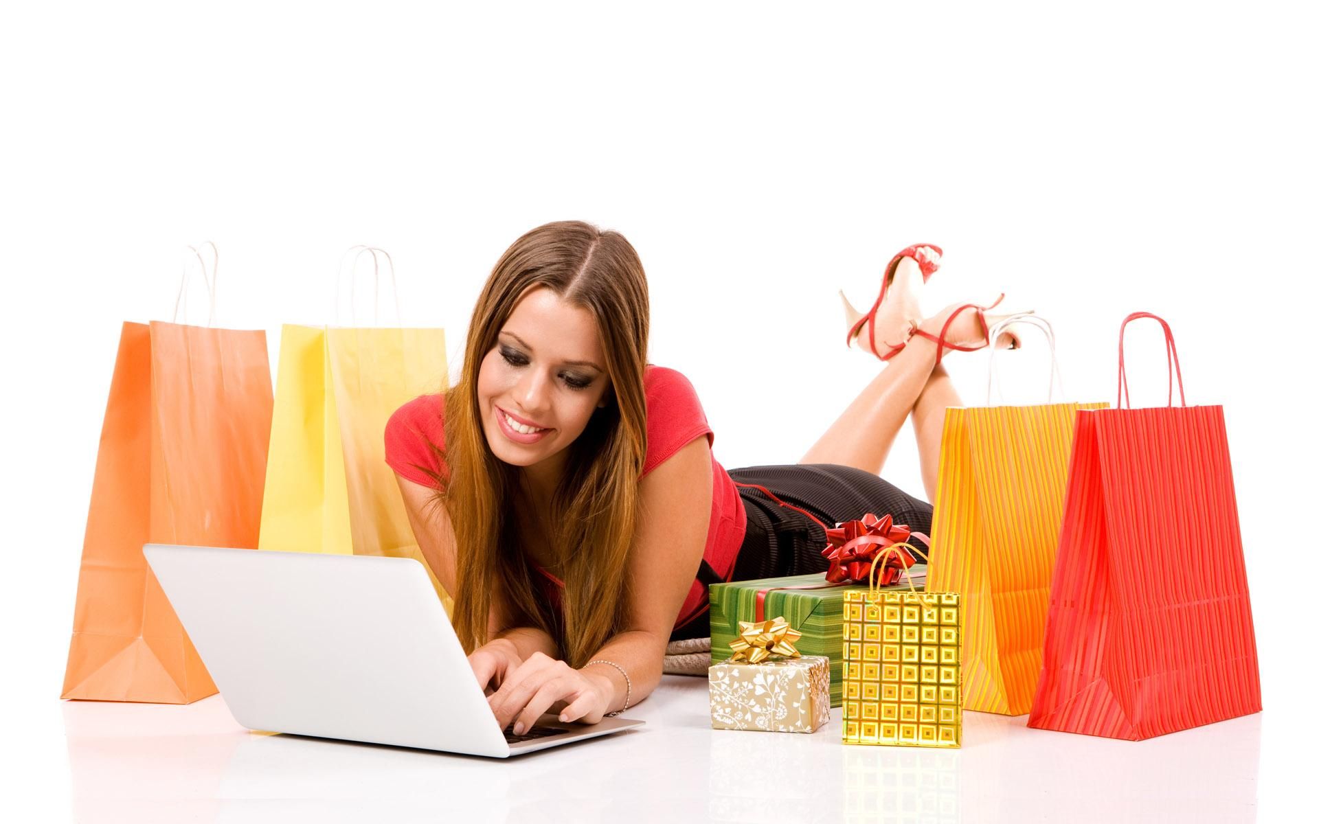 Beautiful young woman shopping over internet.