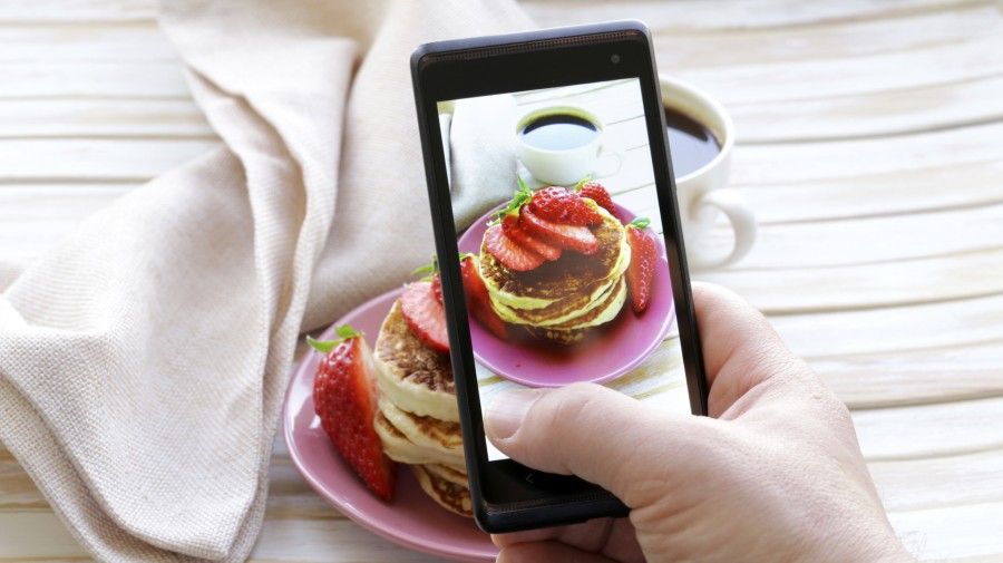 smartphone shot food photo - pancakes with strawberries for breakfast