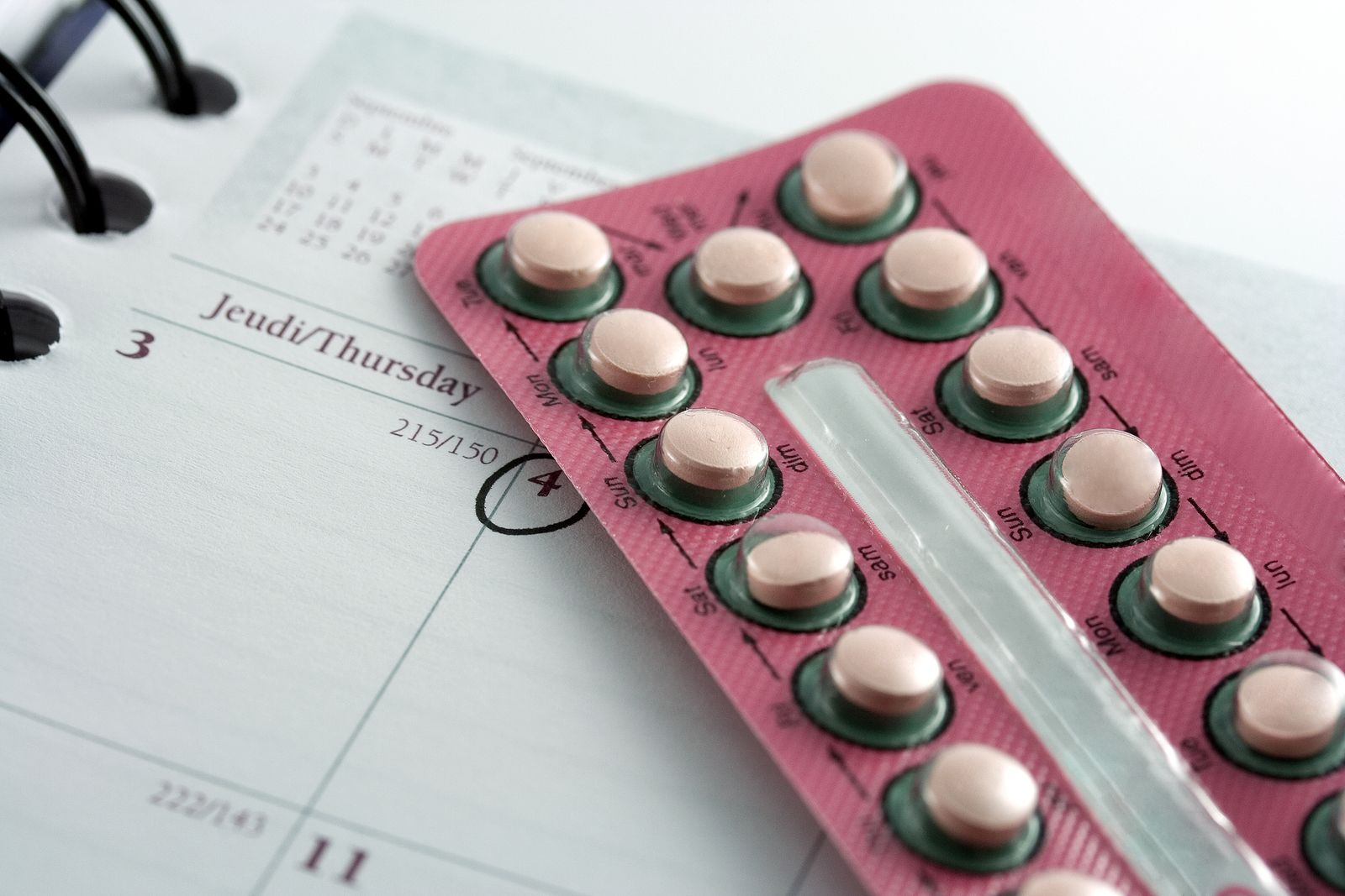 Closeup of a birth control pills blister on a diary after an appointment with a doctor