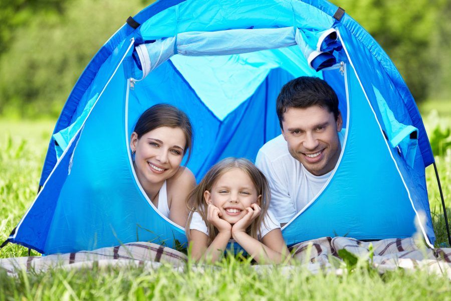 Family with a child in a tent