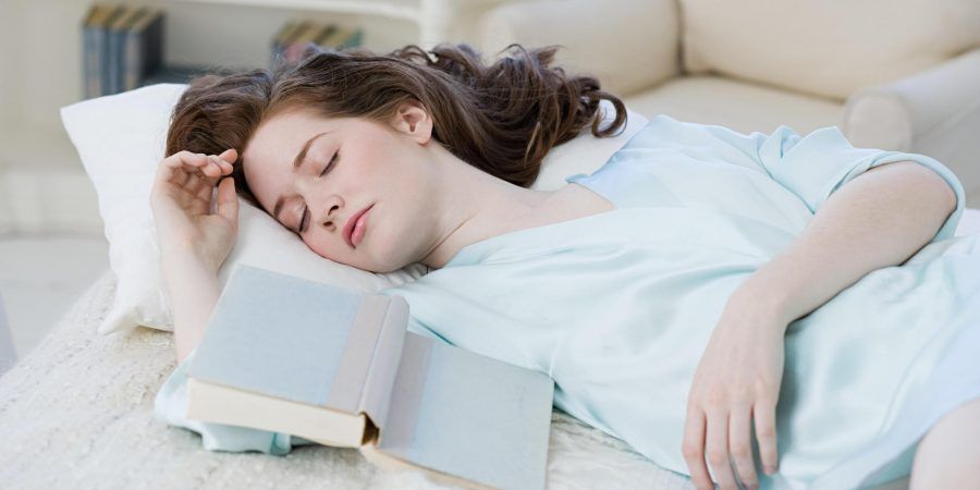 Woman asleep with book