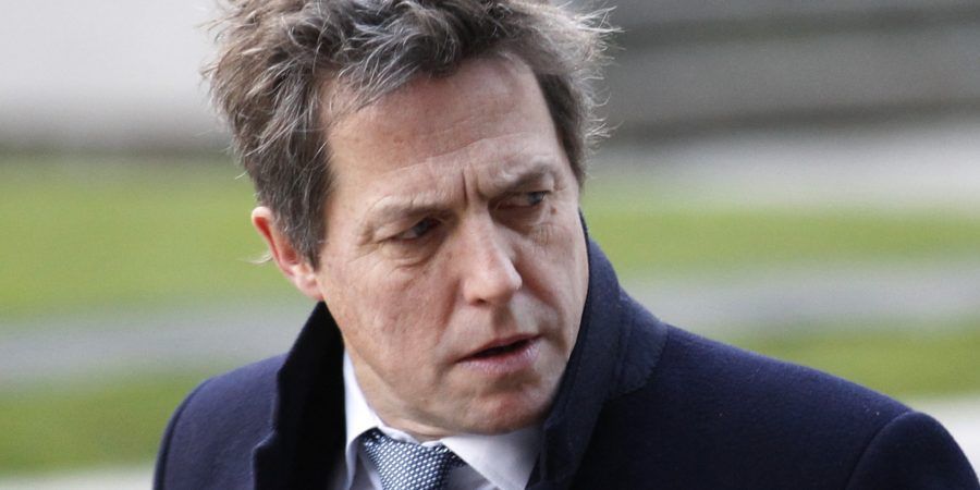 British actor Hugh Grant, who testified to the Leveson Inquiry, arrives at the Queen Elizabeth II Conference Centre in London where Lord Justice Brian Leveson is to release his report, after a year long inquiry, into the culture and practices of the British press and his recommendations for future regulation to prevent phone hacking, data theft, bribery and other abuses, Thursday, Nov. 29, 2012. (AP Photo/Sang Tan)