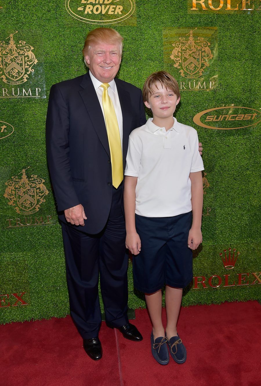 PALM BEACH, FL - JANUARY 04: Donald Trump and Barron Trump attends Trump Invitational Grand Prix Mar-a-Lago Club at The Mar-a-Largo Club on January 4, 2015 in Palm Beach, Florida. (Photo by Gustavo Caballero/Getty Images)