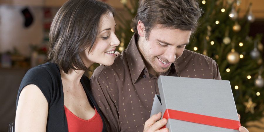 A husband and wife exchanging gifts