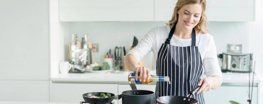 woman-cooking-over-stove-in-kitchen__hero