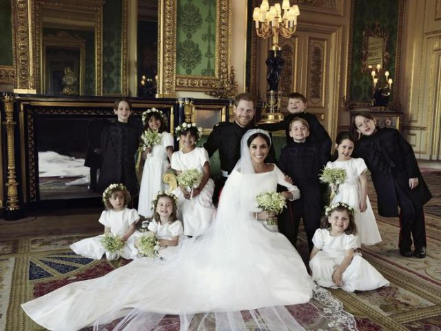 In this photo released by Kensington Palace on Monday May 21, 2018, shows an official wedding photo of Britain's Prince Harry and Meghan Markle, center, in Windsor Castle, Windsor, England, Saturday May 19, 2018. Others in photo from left, back row, Brian Mulroney, Remi Litt, Rylan Litt, Jasper Dyer, Prince George, Ivy Mulroney, John Mulroney; front row, Zalie Warren, Princess Charlotte, Florence van Cutsem. (Alexi Lubomirski/Kensington Palace via AP)