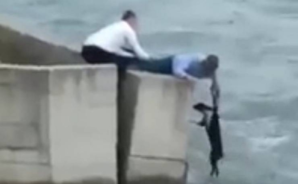 Dog in danger of drowning during a wedding