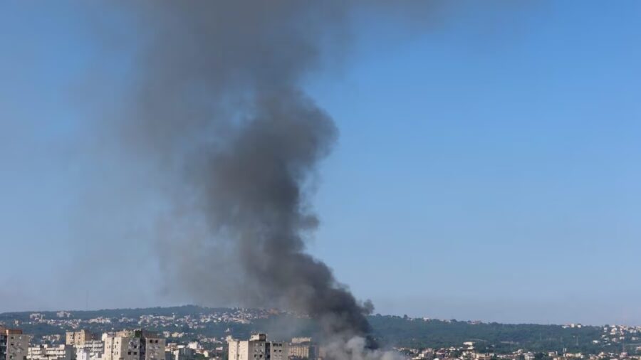 black column of smoke over Naples